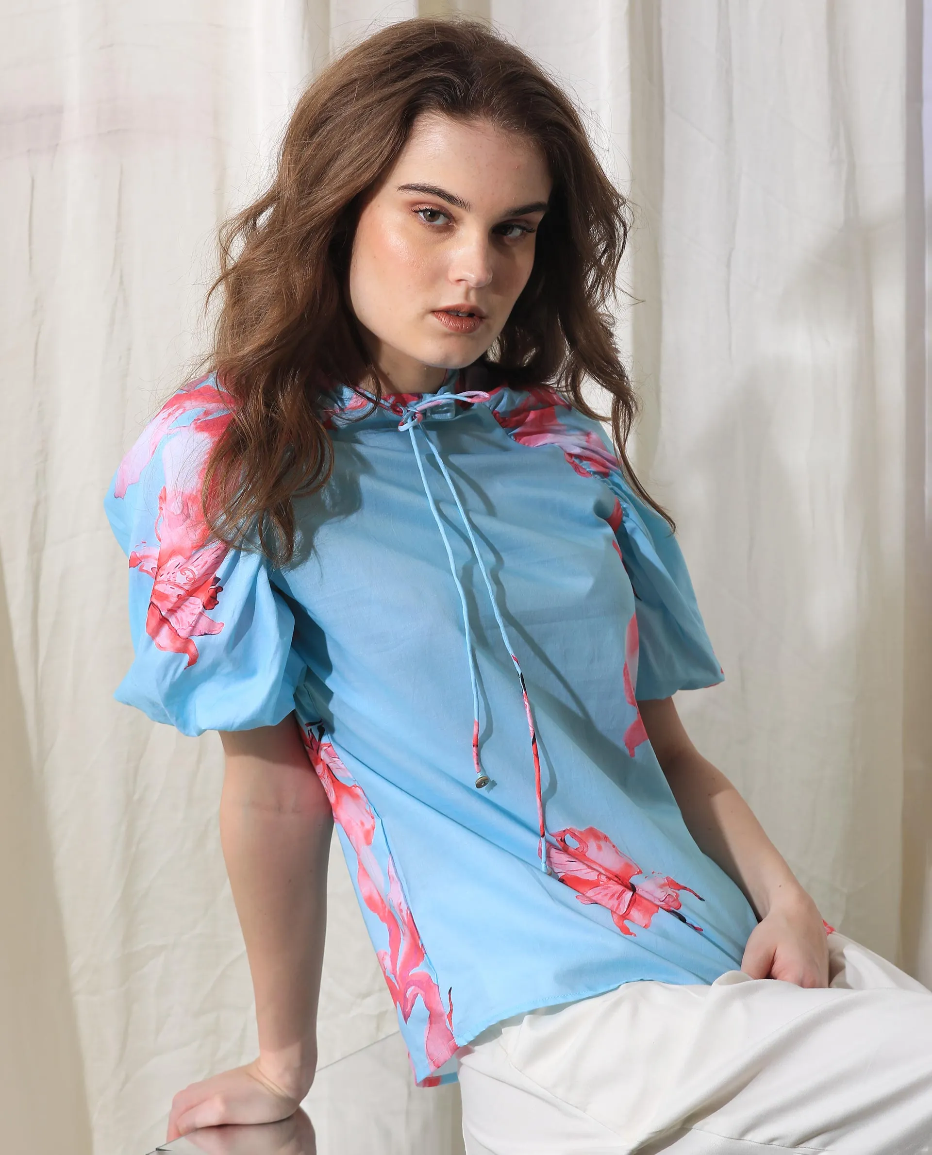 Rareism Women Kink Blue Cotton Fabric Short Sleeves Button Closure Tie-Up Neck Puff Sleeve Relaxed Fit Floral Print Top